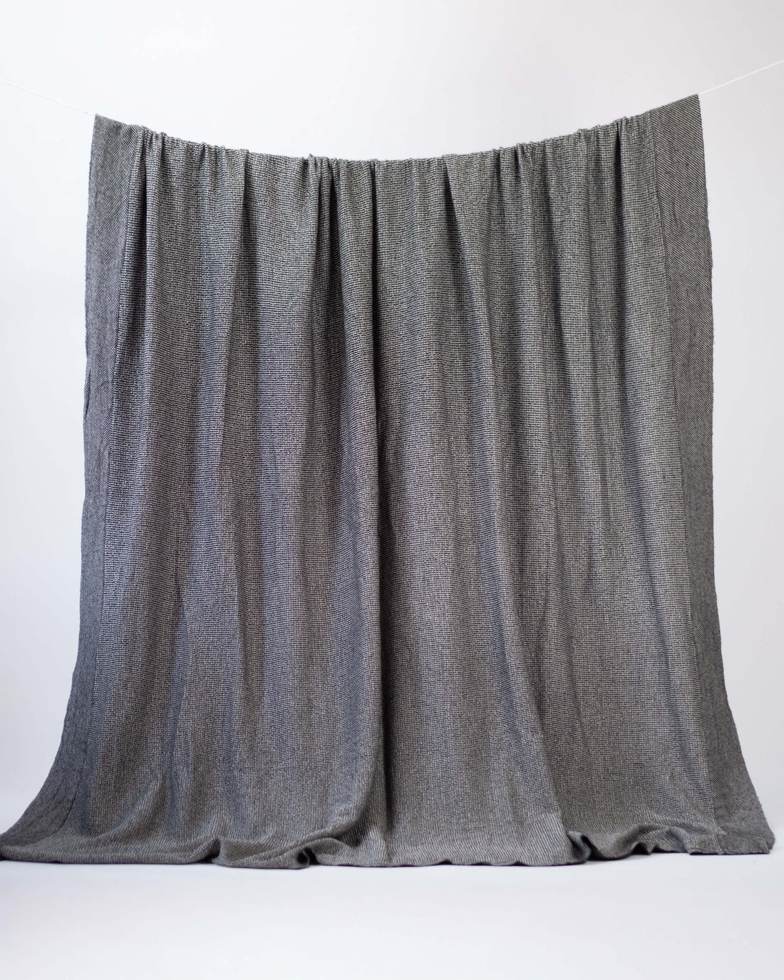 The Micro Waffle Wool Blanket in Charcoal